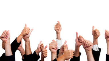 Business People with Thumbs Up on White Background.
